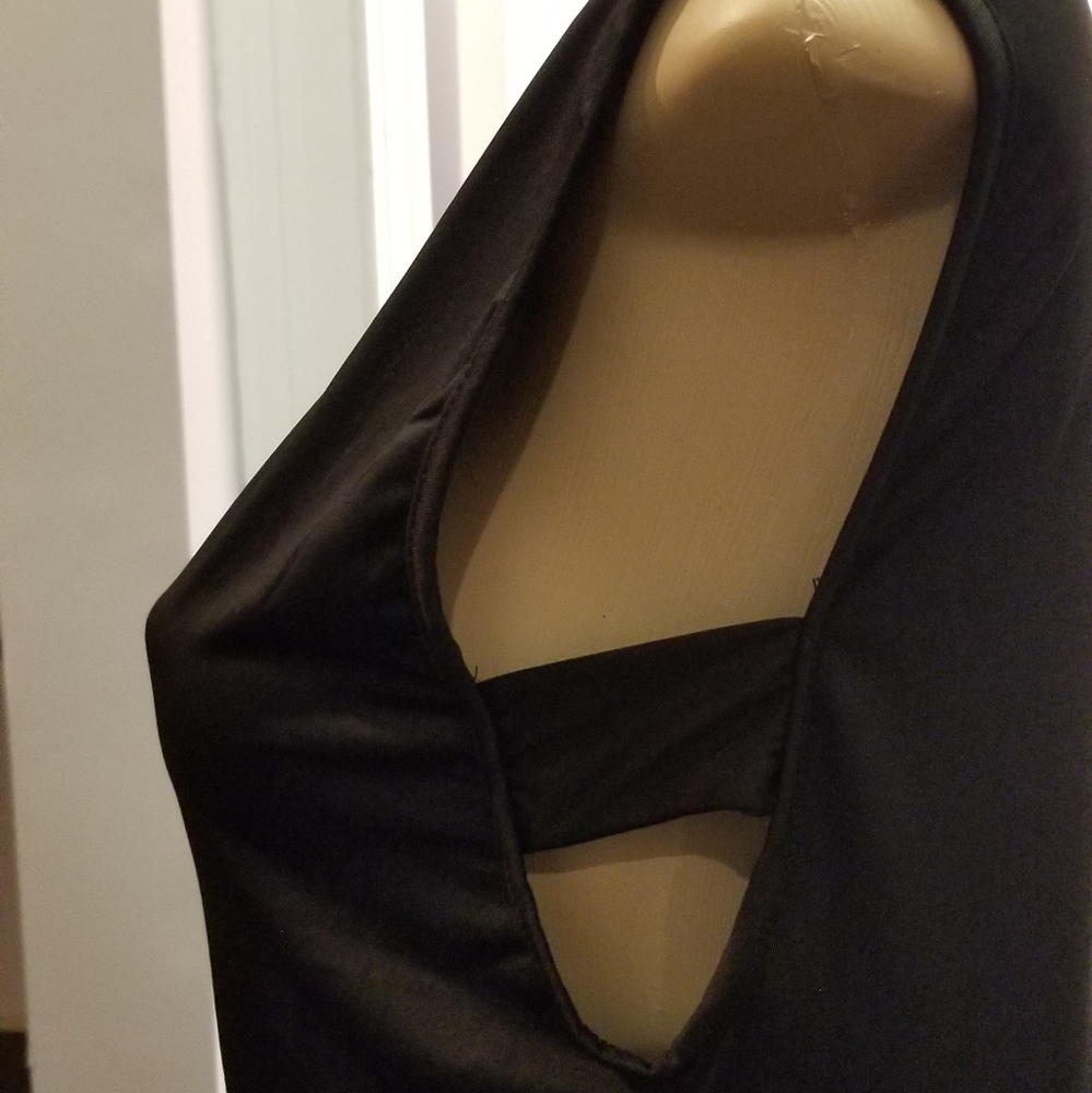 Black top with cutout at neck and sides